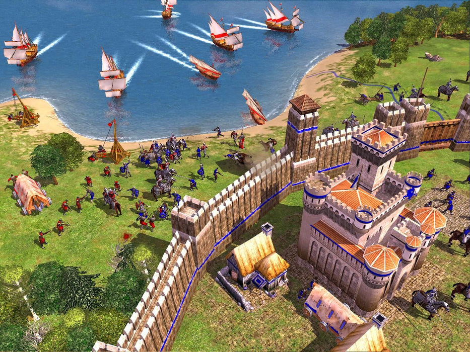 Screenshot of Empire Earth 2 Gold Edition PC GOG in-game screenshot showing a medieval battle scene with knights defending a fortified castle while enemy troops attack from the shore. Buy your Empire Earth 2 Gold Edition digital key at RushGame.co and lead your civilization to victory across multiple eras