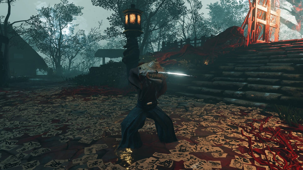 Gameplay screenshot - A dark and eerie combat scene from Ghost of Tsushima Director’s Cut on PC, featuring a mysterious enemy wielding a katana under a glowing lantern, surrounded by scattered paper talismans. Embark on Jin Sakai’s journey and unlock your Steam CD Key at RushGame.co