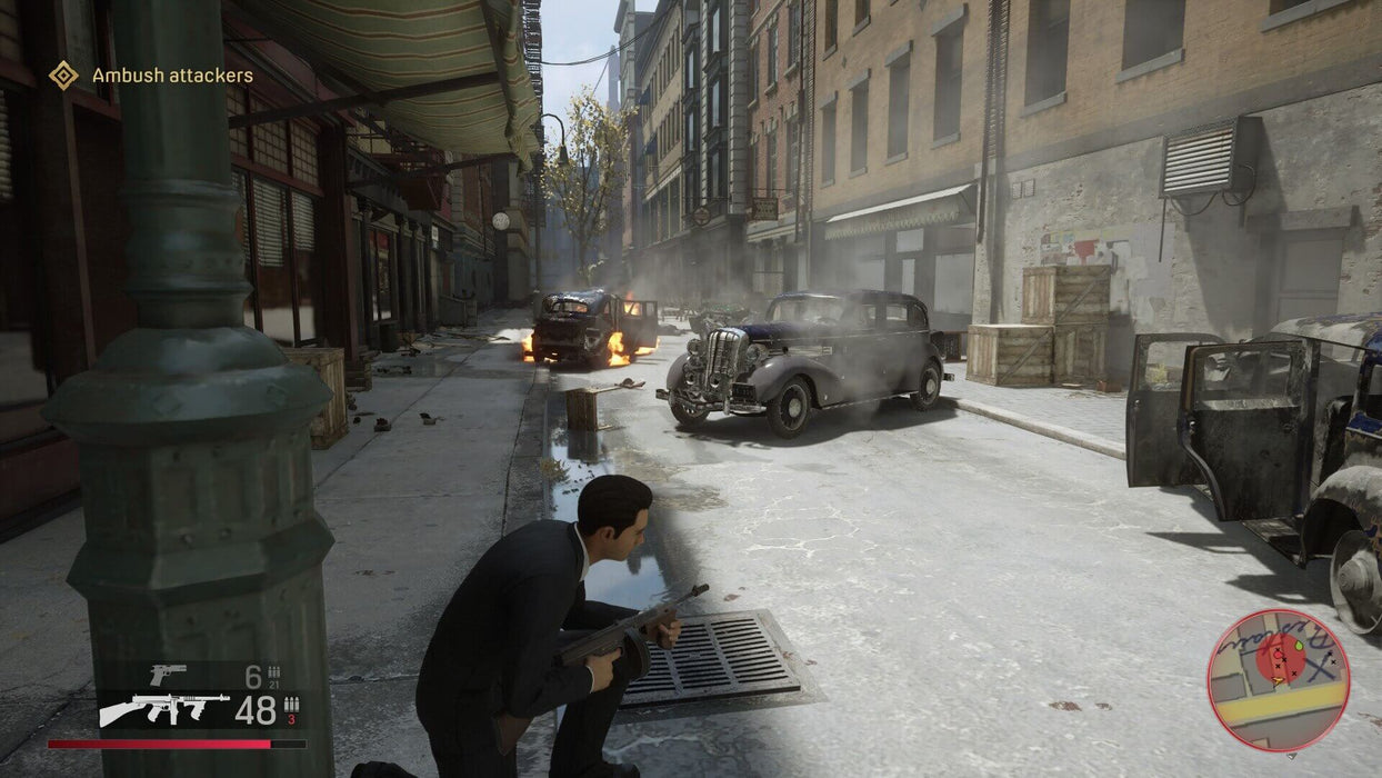 A tense ambush scene unfolds in Mafia Definitive Edition on xbox one, with the main character crouched and ready to fight in the war-torn streets. Buy your Mafia Definitive Edition xbox key today at RushGame.co