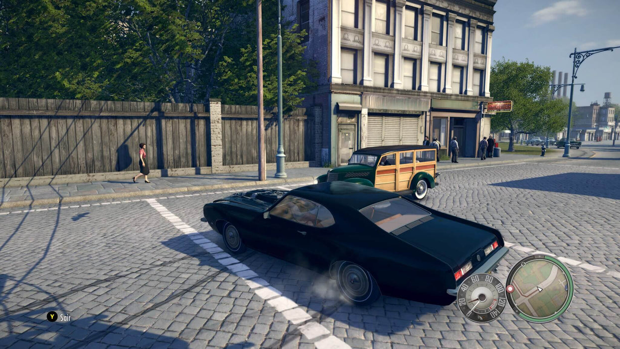 The protagonist drives a sleek black muscle car in Mafia II Definitive Edition PC Steam, navigating the city streets. Get your Mafia II Definitive Edition Steam Key at RushGame.co for thrilling car chases and mob drama