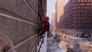 Spider-Man clings to the side of a snowy building, surrounded by a cityscape in 'Marvel's Spider-Man: Miles Morales' on PC Steam. Get your digital key at RushGame.co.