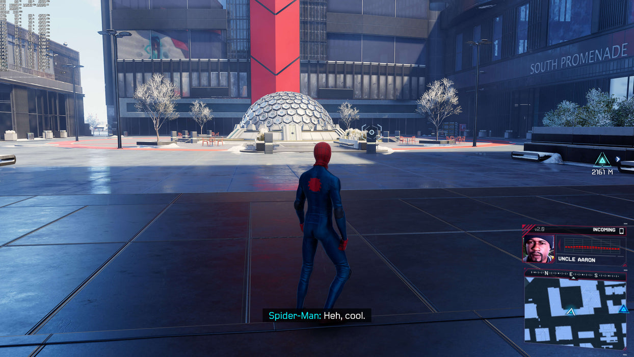 Miles Morales stands in front of a futuristic dome with dialogue on screen in 'Marvel's Spider-Man: Miles Morales' PC Steam version. Available for purchase at RushGame.co.