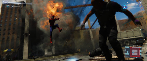 Spider-Man leaps through an explosion, dodging debris in an action-packed moment from Marvel's Spider-Man Remastered on PS5. Experience high-octane web-slinging and get your PS5 game key at RushGame.co