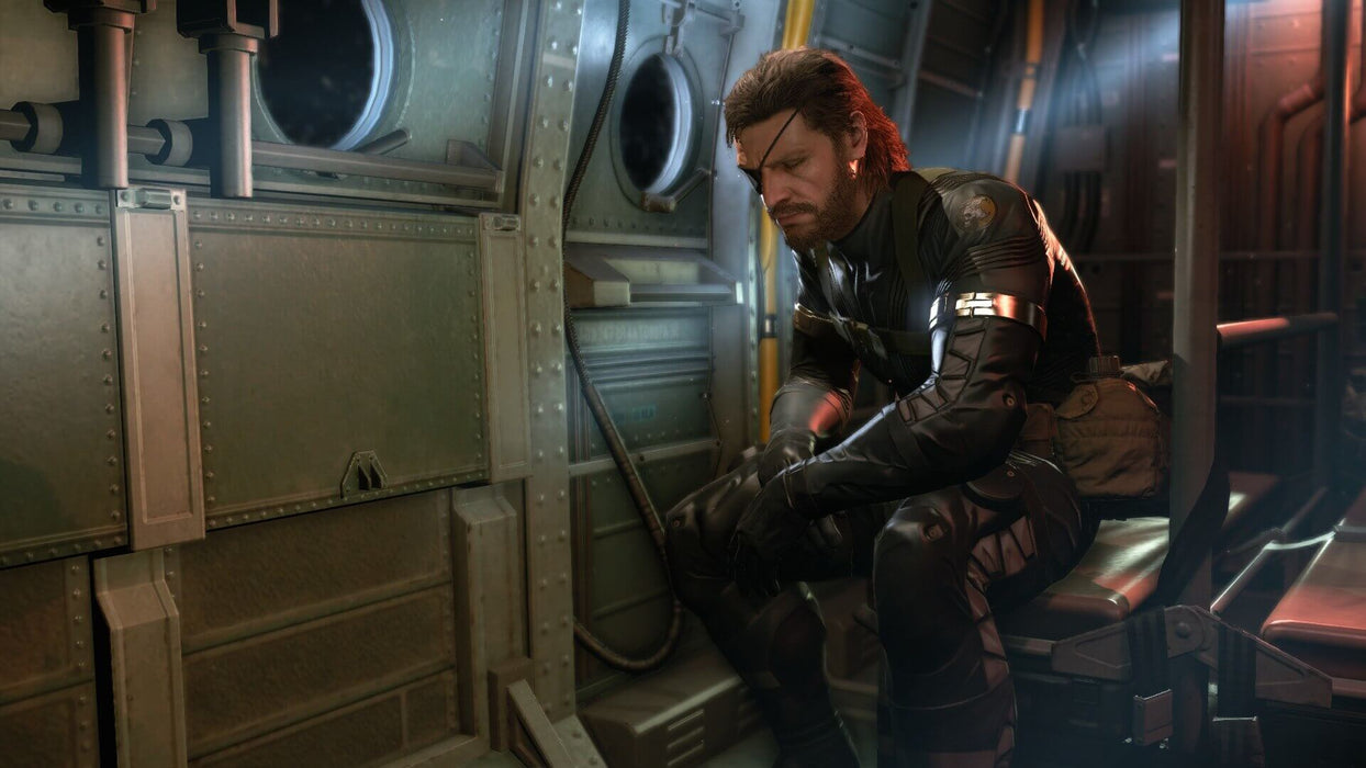 Snake sits solemnly inside a helicopter, deep in thought in Metal Gear Solid V: Ground Zeroes on PC Steam. Buy the game at RushGame.co.