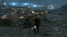 Snake sneaks through a rainy night, carrying a captive towards an enemy base in Metal Gear Solid V: Ground Zeroes on Xbox One. Get your key at RushGame.co.