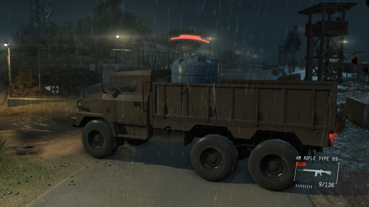 Snake, hidden behind a truck, prepares for night operations under the cover of heavy rain. Unlock intense tactical combat in Metal Gear Solid V: The Phantom Pain on PC Steam, only at RushGame.co