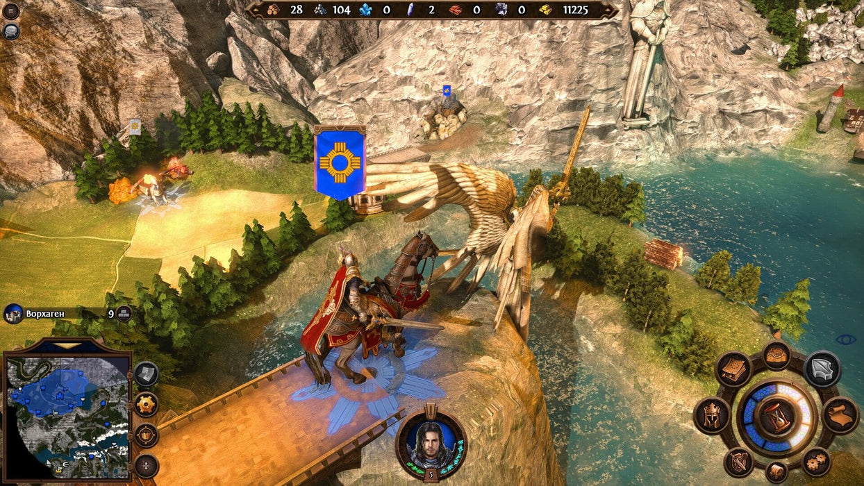 A strategic view in Might & Magic: Heroes VII on PC Uplay, featuring a knight on horseback crossing a bridge with a large winged statue nearby. Explore the fantasy world of Might & Magic in strategic combat. Available now at RushGame.co