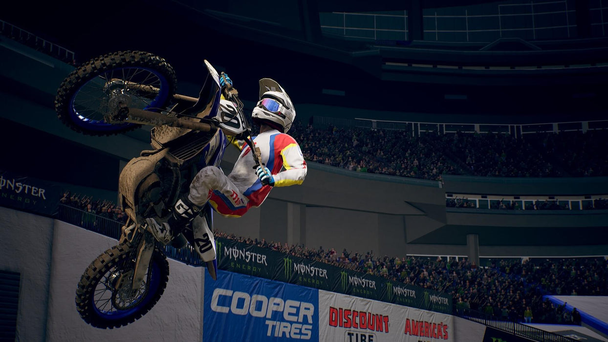 A dirt bike rider performing a thrilling mid-air stunt during a race in Monster Energy Supercross 3 Special Edition on Xbox. Get your game key at RushGame.co to experience high-speed motocross action