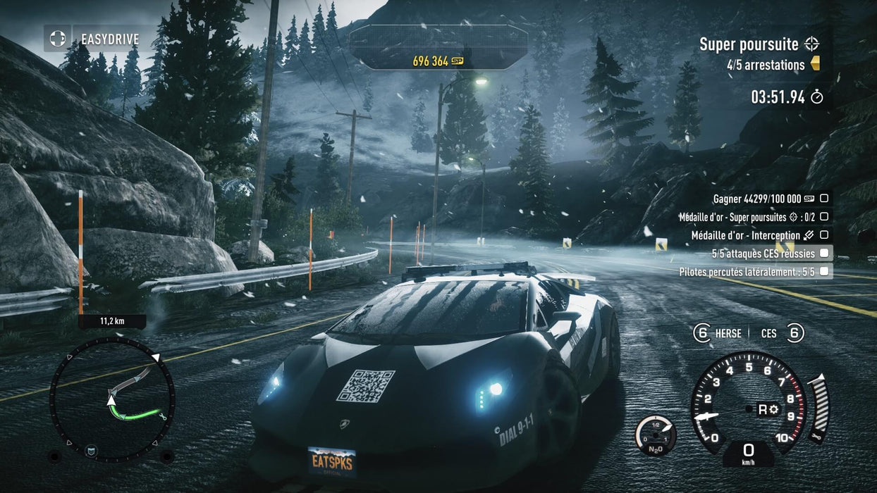 Screenshot of a police pursuit in Need for Speed Rivals Complete Edition on PC EA Play – A police supercar races through a mountainous road during a high-speed pursuit, with snowy weather adding intensity. The interface shows player statistics and current objectives. Available now at RushGame.co