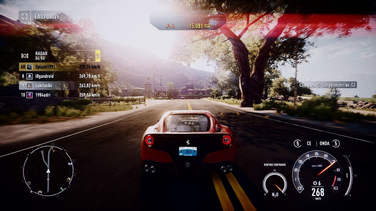 Ferrari racing down the highway in Need for Speed Rivals Complete Edition on PC EA Play – A red Ferrari races through a scenic highway, pushing 268 km/h, as players compete in a multiplayer match. The sun sets in the background, casting a dramatic light on the race. Purchase this thrilling game on RushGame.co