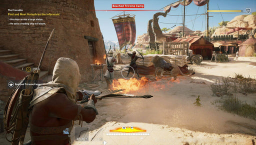 A combat scene from Assassin's Creed Origins, where Bayek is engaged in battle with enemies in a sunlit desert camp, wielding his bow against an armored foe. Experience the action-packed world of ancient Egypt by purchasing your Ubisoft Connect CD key at RushGame.co