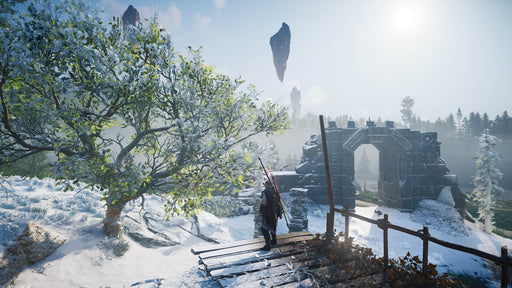 A stunning winter landscape from Assassin's Creed Valhalla, where the protagonist stands near an ancient stone archway, overlooking the snowy terrain. Enhance your Viking saga with the Season Pass CD Key, available at RushGame.co for instant digital delivery