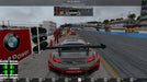 A rear-view perspective of an orange BMW M3 racing under a dark sky, with glowing taillights illuminating the track. Buy your Assetto Corsa CD Key at RushGame.co and immerse yourself in the thrill of high-speed night racing.