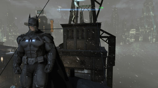 Screenshot from Batman: Arkham Origins on PC Steam, showing Batman surveying Gotham's skyline in a dark, snowy atmosphere. Purchase your Steam CD key at RushGame.co and step into the shoes of the Caped Crusader!