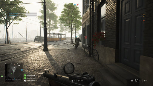 A Battlefield V gameplay scene set in a war-torn European city, featuring a soldier running down a cobblestone street with a tram in the background. Engage in intense FPS action with a PC CD key from RushGame.co