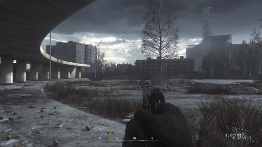 game screenshot:  A stunning in-game screenshot showcasing the eerie and abandoned city of Pripyat, with a silenced pistol in hand, during the legendary sniper mission “All Ghillied Up.” Unlock this unforgettable remastered experience with an instant Xbox One digital key from RushGame.co