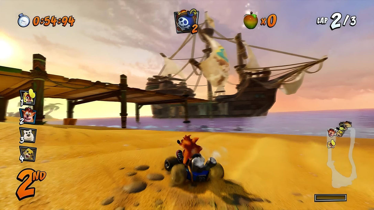 Gameplay screenshot: A high-speed race in Crash Team Racing Nitro-Fueled, featuring Crash Bandicoot driving along a sandy beach track with a pirate ship in the background. The vibrant graphics and classic kart racing action make this a must-play for fans of arcade racers. Get your digital key at RushGame.co.