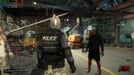 gameplay screen: A scene from Dead Rising 3, where a player-controlled character dressed as a police officer in tactical gear stands in a warehouse, facing an NPC wearing a fedora and stylish outfit. The setting includes a helicopter and industrial equipment. Purchase the game at RushGame.co