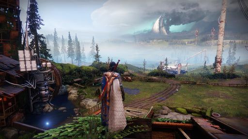 Gameplay screenshot: A scenic view in Destiny 2, showcasing a lush, green environment with a futuristic city in the distance. A player character in a detailed cape and armor stands at the edge, overlooking the vast landscape. Buy Destiny 2 expansions at RushGame.co