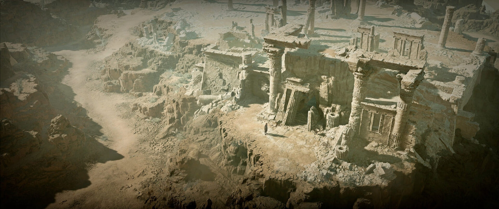 Gameplay screenshot - A desolate desert landscape in Diablo IV, featuring ancient ruins and towering crumbling pillars. A lone traveler walks along a sun-scorched path, surrounded by remnants of a long-lost civilization. Get your Diablo IV Xbox One & Series X|S CD Key now at RushGame.co and explore this vast world