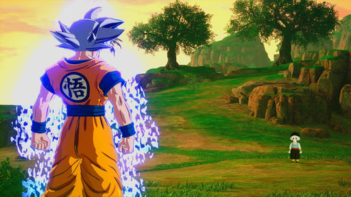 Gameplay screenshot - Ultra Instinct Goku standing in a lush open-world environment in Dragon Ball: Sparking! ZERO on PC Steam, radiating immense energy. Master the power of the Saiyansâget your digital CD key now at RushGame.co and start your DBZ adventure