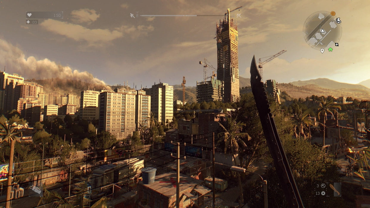 In game screenshot - A vast cityscape from Dying Light: Definitive Edition, with towering buildings and smoke rising in the distance as a player holds a sharp melee weapon. Explore, survive, and fight hordes of zombies in this action-packed Xbox One adventure. Get your CD Key now at RushGame.co!