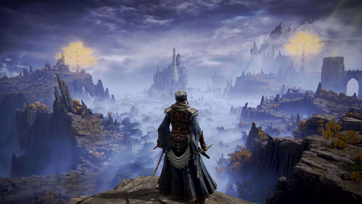 Game screenshot - A lone warrior stands on a cliffside, overlooking a breathtaking fantasy landscape in Elden Ring for PC Steam (NA). Towering ruins and golden Erdtree glow in the distance, shrouded in mystical mist, showcasing the vast open world of the Lands Between. Get your Elden Ring CD Key now at RushGame.co and begin your legendary journey