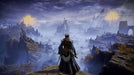 Game screenshot - A lone warrior stands on a cliffside, overlooking a breathtaking fantasy landscape in Elden Ring for PC Steam (NA). Towering ruins and golden Erdtree glow in the distance, shrouded in mystical mist, showcasing the vast open world of the Lands Between. Get your Elden Ring CD Key now at RushGame.co and begin your legendary journey