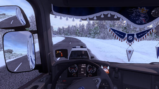 Gameplay screenshot - First-person cockpit view from a truck driving through a snowy road in Euro Truck Simulator 2, with a police car visible in the rearview mirror. Experience realistic winter driving conditions and detailed truck interiors. Purchase your Euro Truck Simulator 2 PC Steam CD Key now at RushGame.co