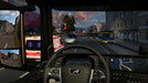 Gameplay screenshot - In-cabin driving view from Euro Truck Simulator 2 - West Balkans DLC, featuring a truck stopped at a red light in a city. The dashboard displays navigation details while trams and ambulances pass by, showcasing the realistic traffic system. Buy Euro Truck Simulator 2 - West Balkans DLC PC Steam CD Key at RushGame.co for an immersive trucking experience