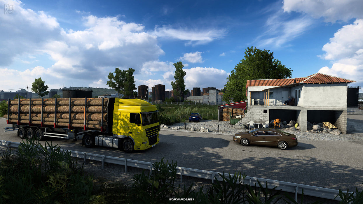 Gameplay screenshot - Scenic countryside road in Euro Truck Simulator 2 - West Balkans DLC, with a yellow truck hauling logs near a rural house. The expansion introduces picturesque landscapes and dynamic cargo missions. Purchase Euro Truck Simulator 2 - West Balkans DLC PC Steam CD Key at RushGame.co and start your journey through the Balkans