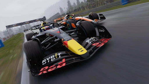 Gameplay screenshot - High-speed racing action in F1 24, featuring a Red Bull Formula 1 car closely followed by McLaren cars on a wet track. The motion blur effect emphasizes the intensity of the race. Get your F1 24 Xbox One & Xbox Series X|S CD Key at RushGame.co and compete in thrilling dynamic weather conditions