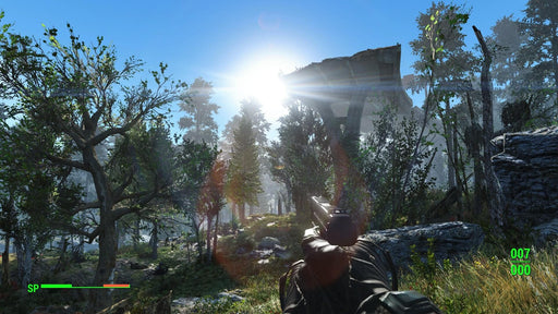 Gameplay screenshot - A player navigates through a dense, sunlit forest in Fallout 4, with a handgun drawn, ready for action. Survive the post-apocalyptic wilderness with Fallout 4 Xbox One CD Key US, available now at RushGame.co