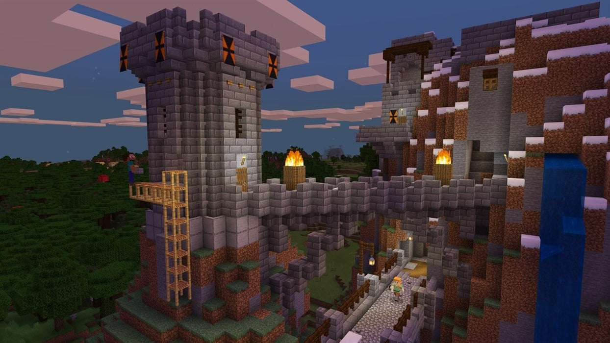 A majestic castle with towering stone structures and torches illuminating the bridge, set in the pixelated landscape of Minecraft Deluxe Collection for Xbox. Experience the creativity and exploration of building in Minecraft, available at RushGame.co