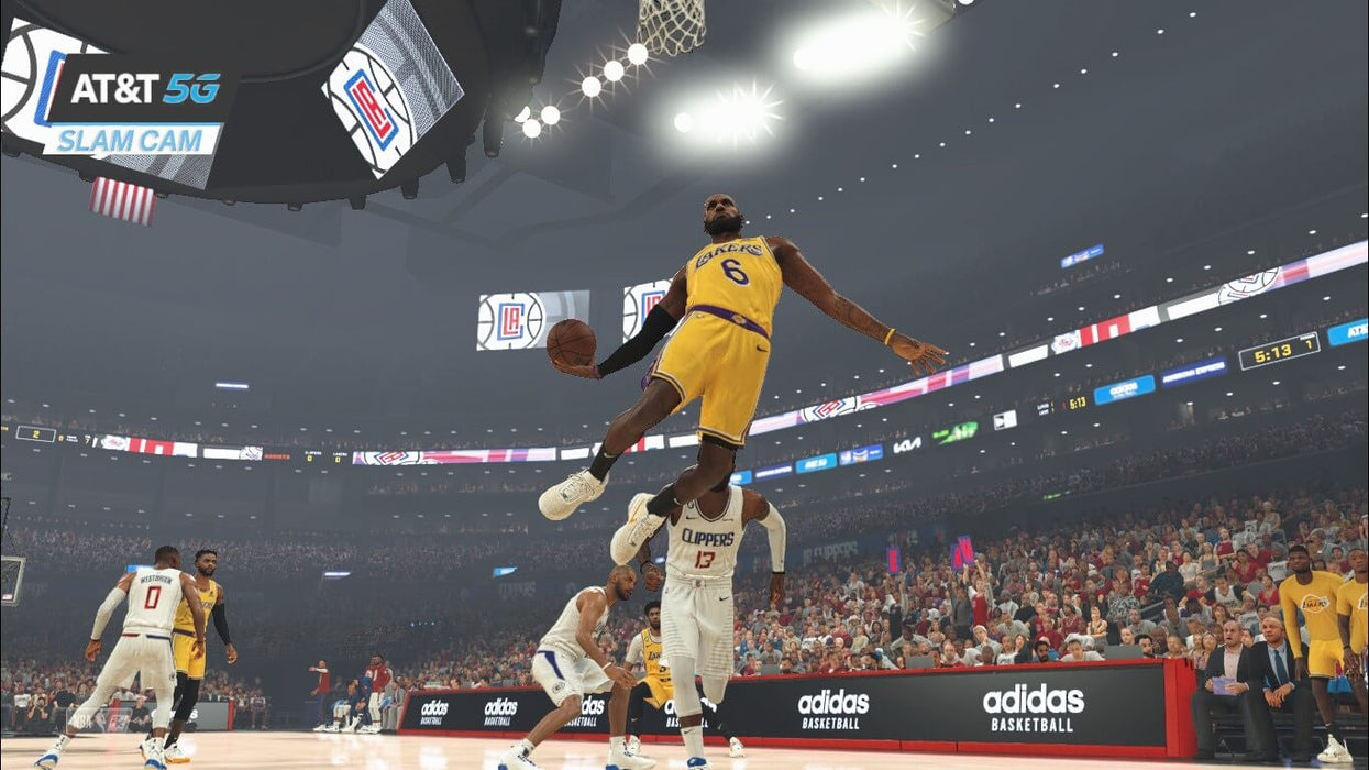 NBA 2K23 Xbox One gameplay - LeBron James slam dunk
A dynamic in-game screenshot from NBA 2K23 on Xbox One, showcasing LeBron James (#6) performing a powerful slam dunk against the LA Clippers during a night match. The stadium is filled with cheering fans as the AT&T 5G Slam Cam captures the action. Available now on RushGame.co