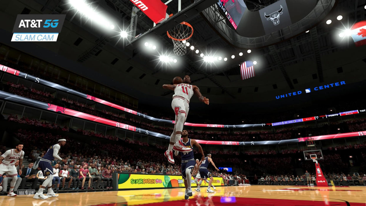 NBA 2K24 gameplay on Xbox showing a slam dunk with AT&T 5G Slam Cam - A player from the Chicago Bulls goes for a powerful slam dunk in NBA 2K24, captured in-game with the AT&T 5G Slam Cam. The basketball arena is filled with cheering fans, providing an immersive NBA gaming experience available on Xbox One Xbox Series. Get your game key at RushGame.co