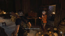 Leon and Ashley in a creepy candle-lit room filled with skulls – Atmospheric shot from Resident Evil 4 Deluxe Edition (2023), with Leon and Ashley preparing to move forward through a haunted location. Purchase the Xbox Series CD Key at RushGame.co for full access