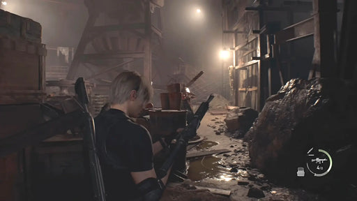 Leon S. Kennedy prepares his rifle in a dark industrial area lit by scattered lights and debris in Resident Evil 4 (2023). Buy the PC Steam CD Key now at RushGame.co and face the horror head-on
