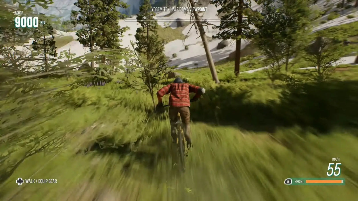 Dynamic gameplay from Riders Republic Complete Edition on PC, capturing a high-speed mountain bike descent through lush forests near Yosemite's Half Dome viewpoint. Available at RushGame.co