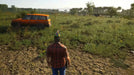 Image from SCUM Supporter Pack 2 DLC on Steam, showing a player exploring a lush field with an orange SUV nearby. Get your SCUM Steam Key - Supporter Pack 2 DLC at RushGame.co for instant digital code delivery and expand your survival experience today
