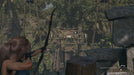 Shadow of the Tomb Raider Definitive Edition gameplay image with Lara Croft aiming a bow at an ancient mechanism. Unlock the adventure with a Steam Key from RushGame.co – your source for instant digital codes