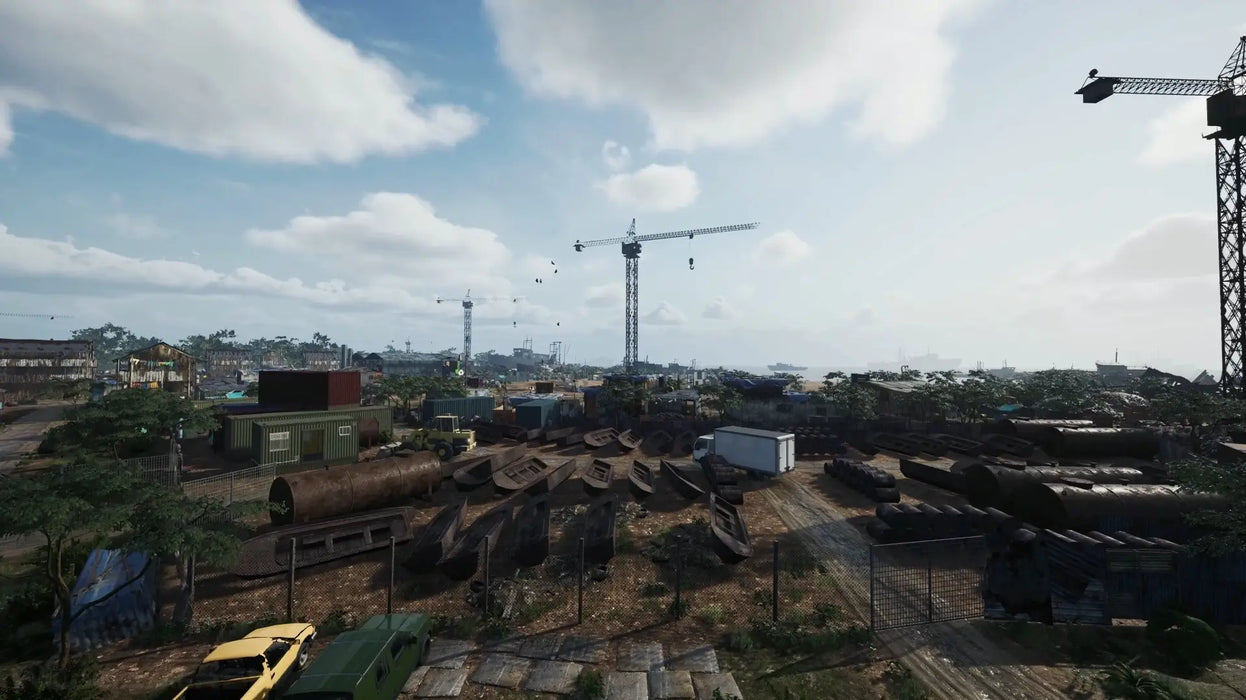 Wide-angle gameplay image from Ship Graveyard Simulator 2 Steam Key highlighting a vast shipbreaking yard filled with containers, cranes, and decommissioned ships under a blue sky. Explore the detailed environments of Ship Graveyard Simulator 2 by buying your Steam code from RushGame.co for secure, fast delivery