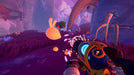 In-game action shot from Slime Rancher 2, featuring the player vacuuming a golden bunny slime in a lush, glowing environment. Get your digital Slime Rancher 2 Steam Key fast at RushGame.co