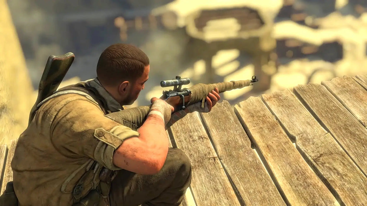 Gameplay image from Sniper Elite 3 Steam edition, featuring the protagonist aiming a scoped rifle from a wooden platform over a desert outpost. Unlock intense sniping missions with a Sniper Elite 3 Steam Key from RushGame.co!