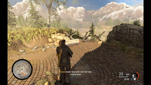 Sniper Elite 4 Deluxe Edition Steam gameplay with the main character setting traps in a mountain pass. Get your digital game key at RushGame.co