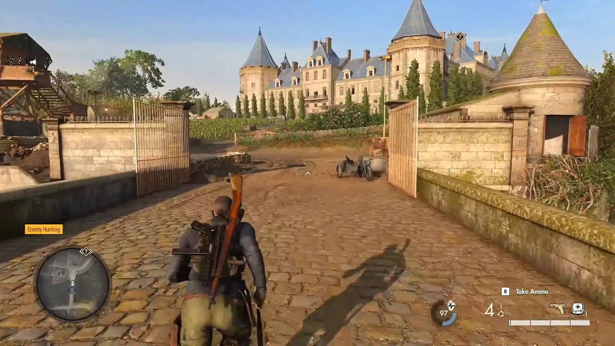 In-game screenshot from Sniper Elite 5 Steam version featuring the main character sneaking through a detailed French château and open courtyard. Get your Sniper Elite 5 Steam Key at RushGame.co for fast, secure digital delivery