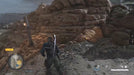 Sniper Elite 5 Steam gameplay showing the protagonist advancing through rugged terrain and rocky cliffs on a mission. Unlock Sniper Elite 5 with a Steam CD key from RushGame.co for immediate code delivery and intense stealth action